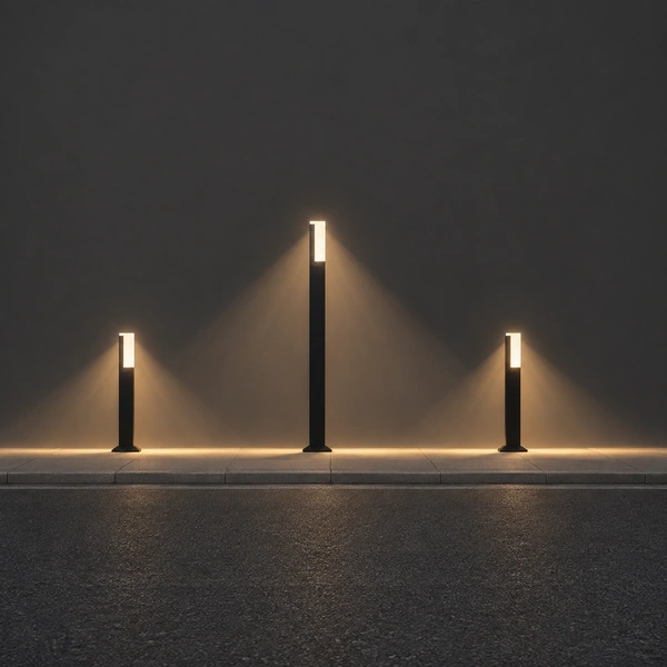 Black OBEL-A luminous crown column glowing beside paved entry planting