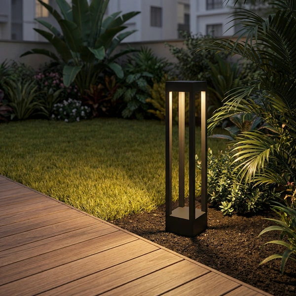 VOID 108mm square bollards lining a garden path by night